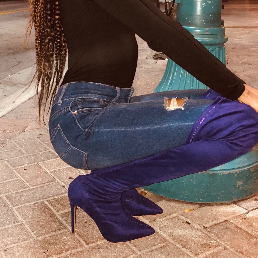 Thigh high purple pointed boots